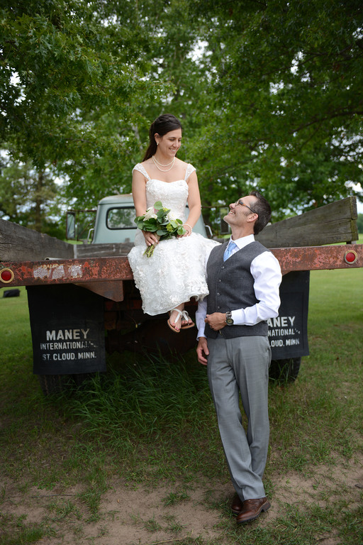 Weddings S&T Shira on truck with Tracy looking up