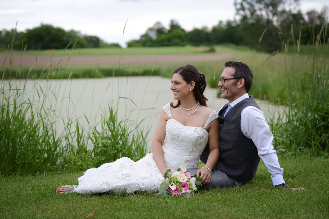 Weddings S&T sitting by pond