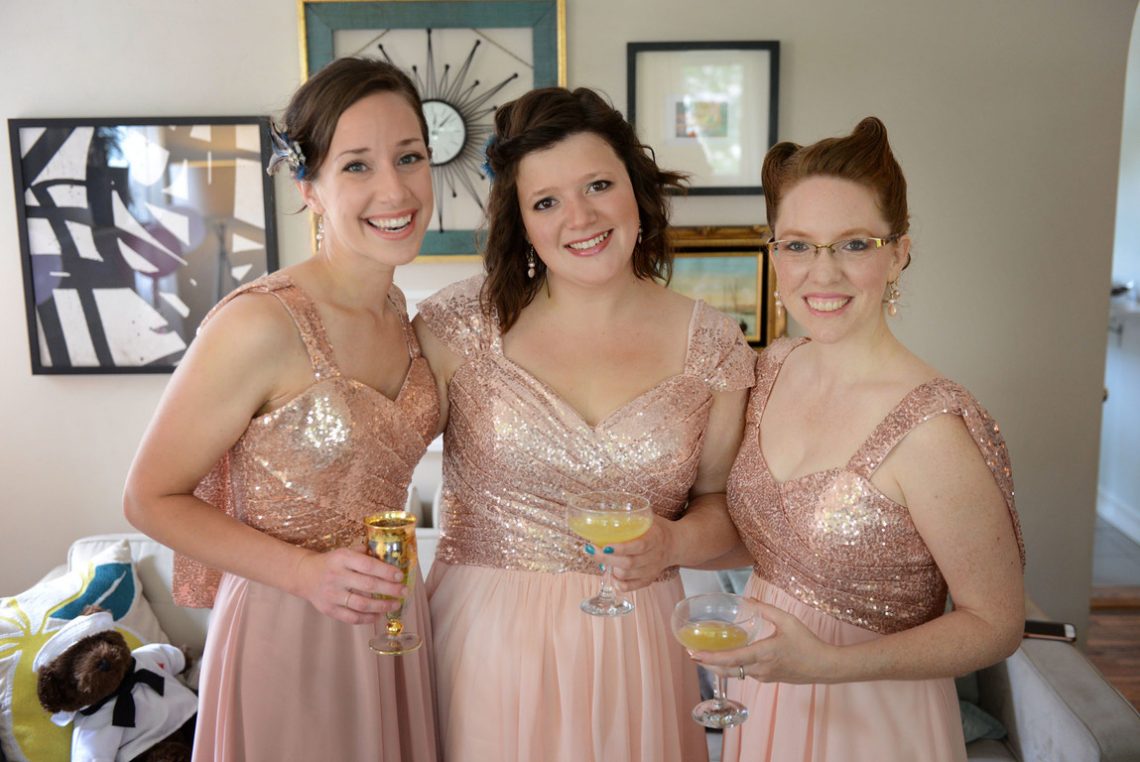 Wedding prep bridesmaids with drinks